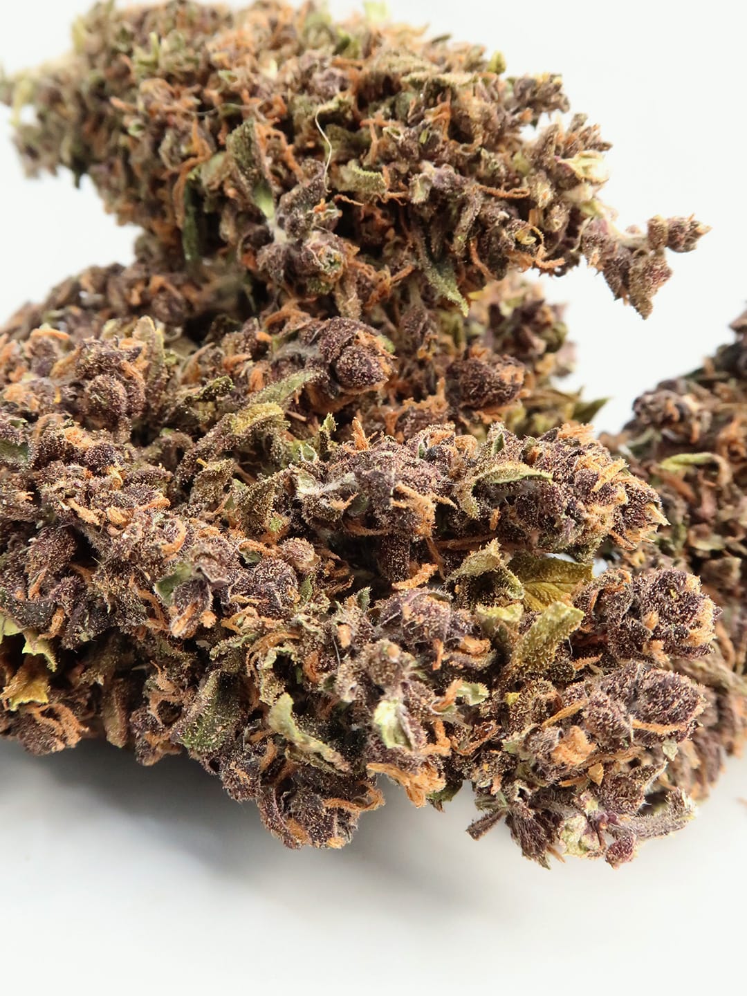 Close-up of Red Syrup Super Budget Hemp Flower (8-13% CBD) by HempElf.com showing vivid trichomes and colors.