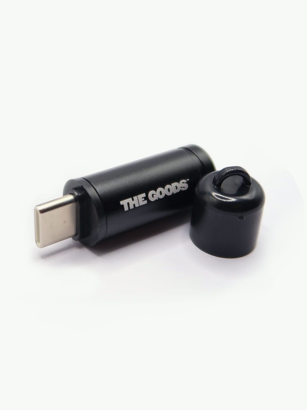 The Goods Phone Lighter, a black USB-C device with cap, is shown on a white background.