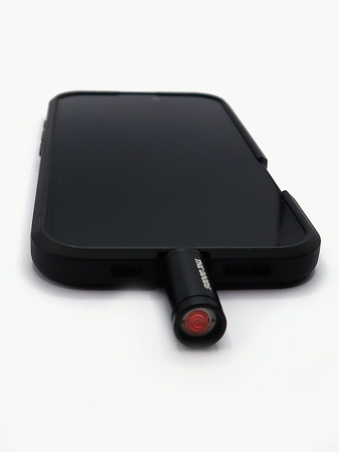 The Goods Phone Lighter by The Goods, a USB C lighter attached to a black smartphone on a white background.